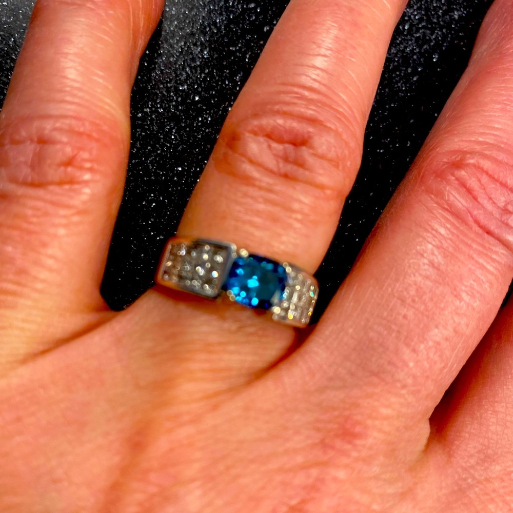 Blue diamond white gold band.